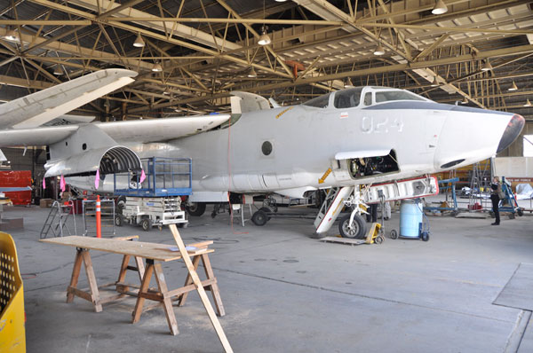 A Navy RA-3 Skywarrior will be displayed at the Castle Air Museum after spending about two years in this hangar, where volunteers are meticulously restoring it.